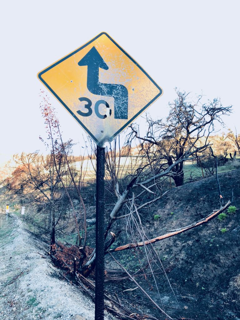 This work is licensed under a Creative Commons Attribution-NonCommercial 4.0 International License by Kenley Neufeld Burned Speed Sign